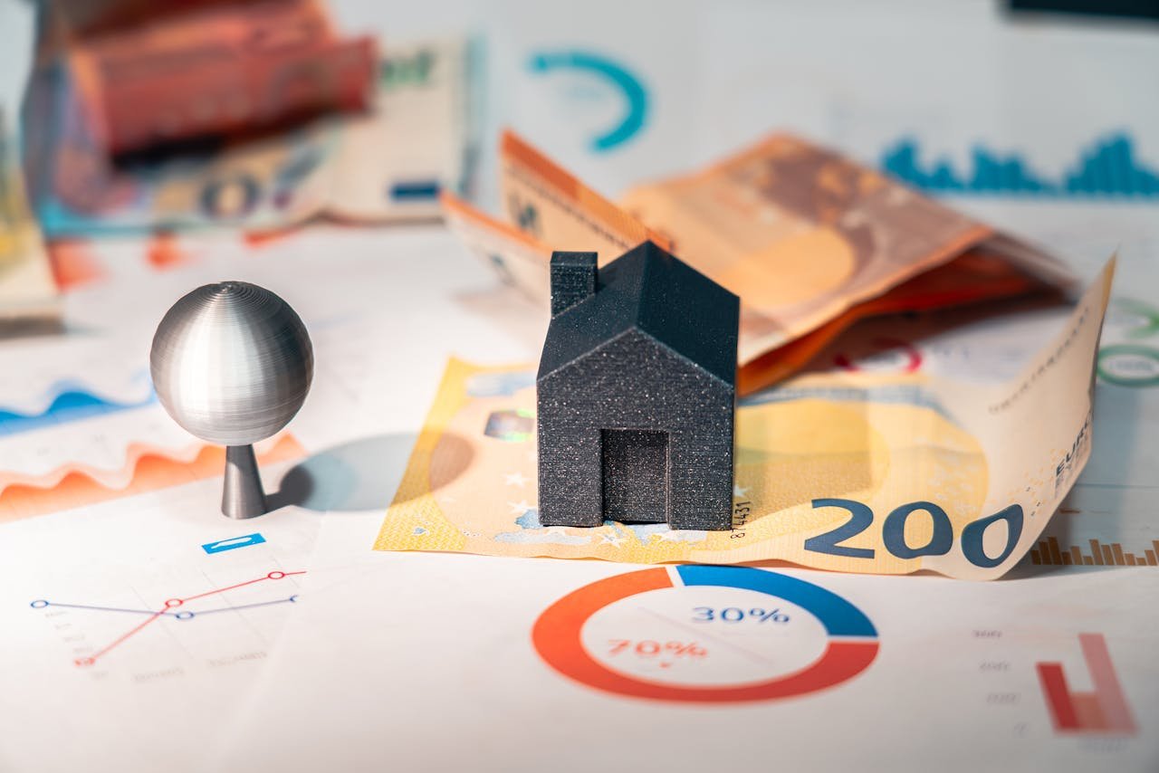 Home Conceptual image of real estate and finance involving euro currency and data charts, symbolizing investment.